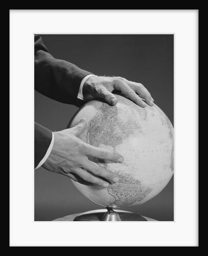 Male hands holding earth globe by Anonymous