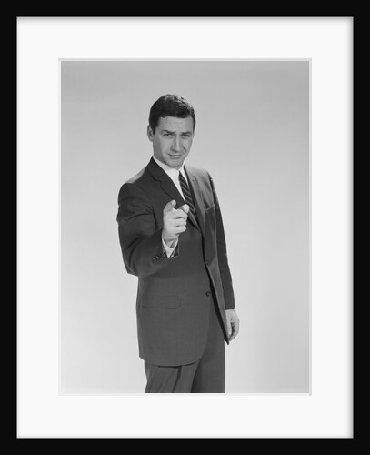 Business man pointing finger toward camera serious facial expression by Anonymous