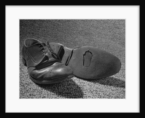 Old shoes well worn with hole in the sole by Anonymous