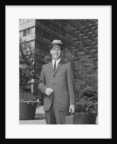 Portrait businessman wearing hat suit holding briefcase by Anonymous