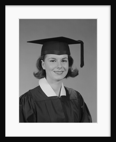 Portrait smiling young woman wearing graduation cap and gown by Anonymous