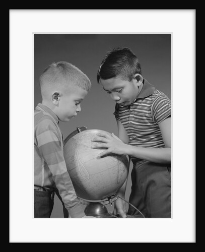 Two boys studying earth globe by Anonymous