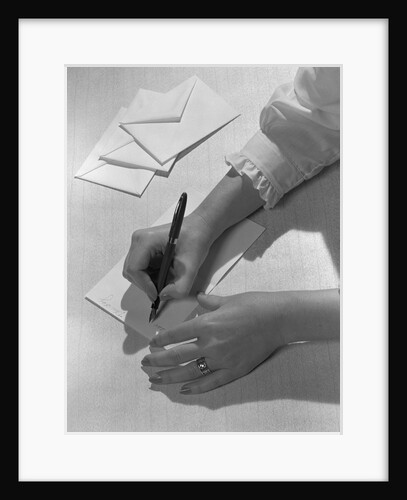 Woman's hands holding pen writing letter on stationery by Anonymous