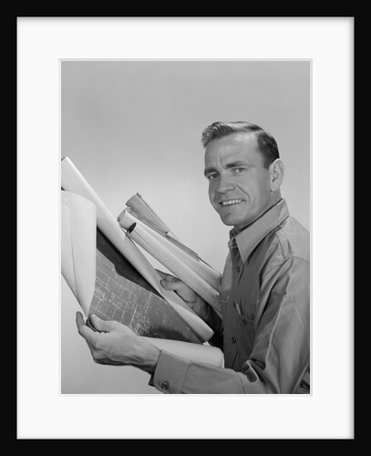 Smiling man builder contractor holding blueprints looking at camera by Anonymous