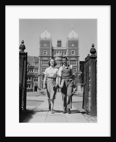 College aged student couple walking through campus gates university of pennsylvania by Anonymous