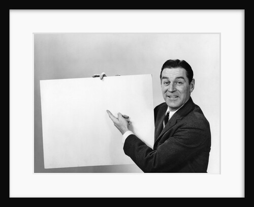 Smiling man pointing to blank poster sign by Anonymous