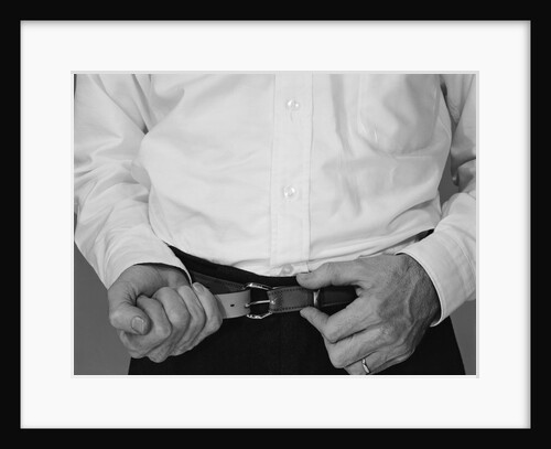 Man hands tightening belt by Anonymous