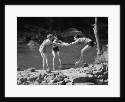 Two women pulling man into woodland swimming pond all wearing bathing suits by Anonymous