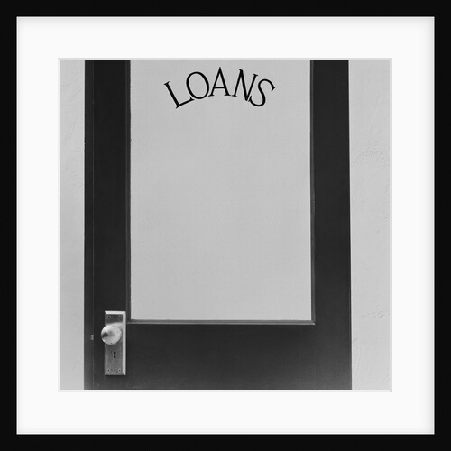 Office door glass panel with sign loans by Anonymous
