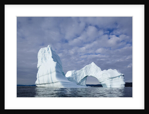 Arched iceberg in Disko Bay in Greenland by Anonymous