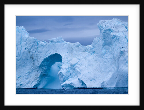 Hole melted in iceberg in Disko Bay in Greenland by Anonymous