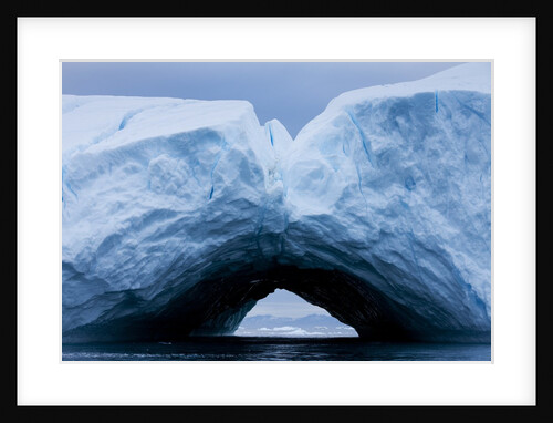 Arched iceberg in Disko Bay in Greenland by Anonymous
