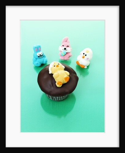 Muffin with chocolate icing and jelly chick for Easter by Anonymous
