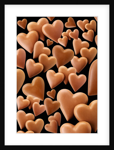 Chocolate hearts, black background by Anonymous