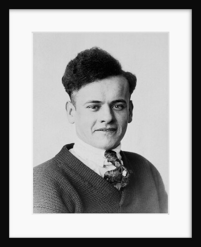 Young man smiles in a formal portrait, ca. 1920 by Anonymous