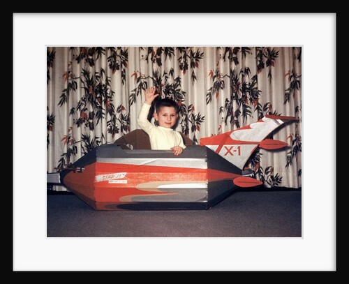 Young boy plays in a cardboard rocketship, ca. 1956 by Anonymous