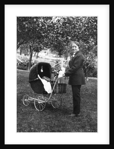 Woman in men's' clothes with a stroller at a baby shower, ca. 1924 by Anonymous