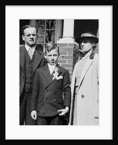 Young boy with his stern looking parents, ca. 1935 by Anonymous