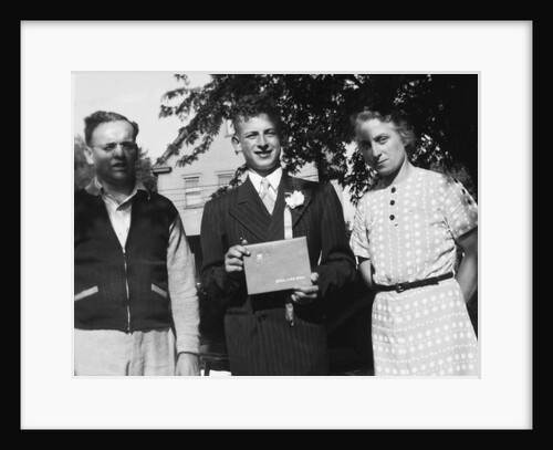 Boy with his parents on his 8th grade graduation, ca. 1940 by Anonymous