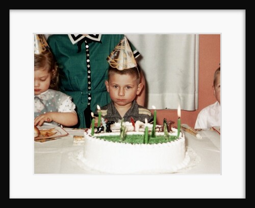 Grumpy boy at fifth birthday party, ca. 1957 by Anonymous