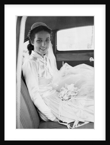 Bride in the backseat of car, ca. 1950 by Anonymous