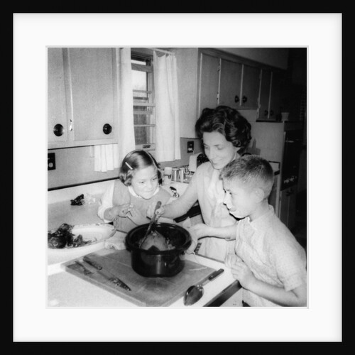 Mom prepares dinner with the kids watching, ca. 1962 by Anonymous