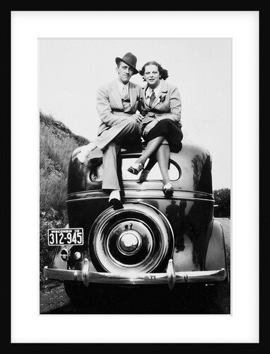 Couple proudly sits on their new car, ca. 1935 by Anonymous