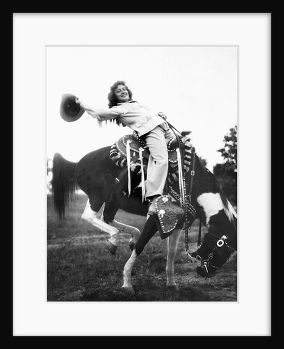 Young woman on phony pony, ca. 1940 by Anonymous