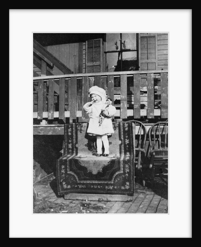 Young girl outside her house, ca. 1921. by Anonymous