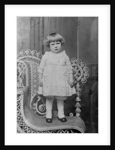 Toddler girl stands for a portrait, ca. 1923. by Anonymous
