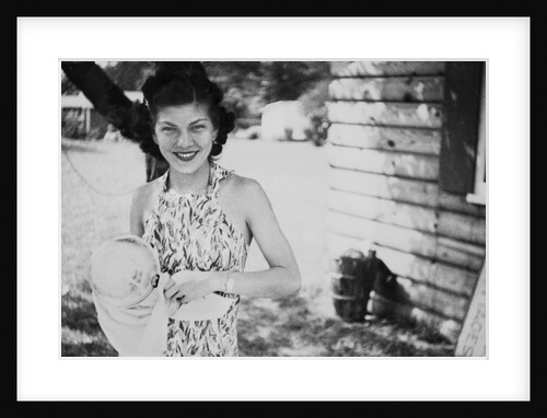 Young woman dries a cooking pot, ca. 1939 by Anonymous
