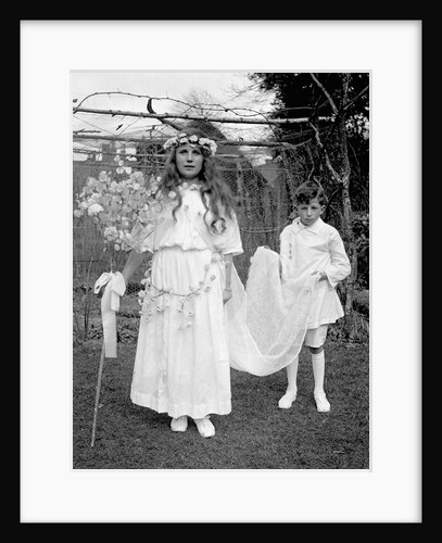Young girl and attending young boy, ca. 1900. by Anonymous