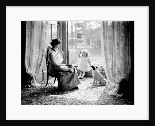 A young girl with her mother and dog in England, ca. 1900. by Anonymous