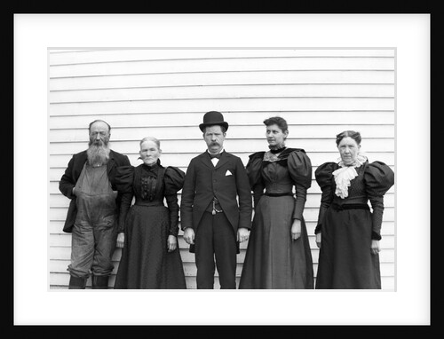 The family poses in their Sunday best, ca. 1900. by Anonymous
