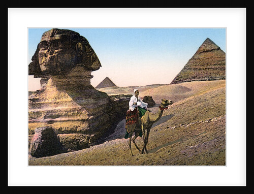 Man riding a camel in front of the Sphinx and pyramids by Anonymous