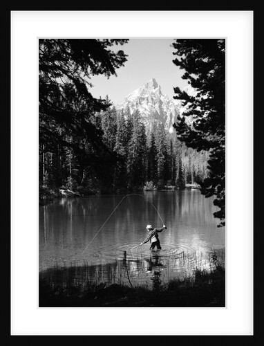 1960s man fishing holding net and rod wyoming grand teton national park string lake by Anonymous