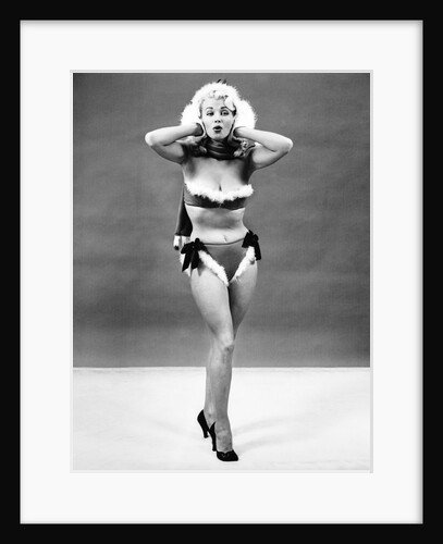 1950s young woman standing inside wearing fur trimmed bikini and gloves by Anonymous