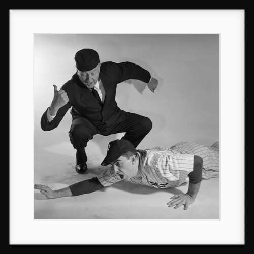 1950s baseball umpire calling sliding player out studio shot by Anonymous