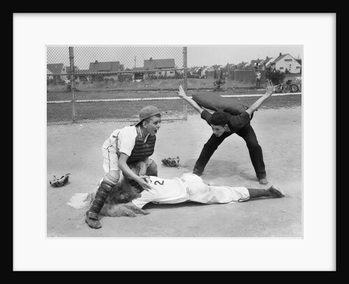 1950s little league umpire calling safe player sliding into home plate by Anonymous
