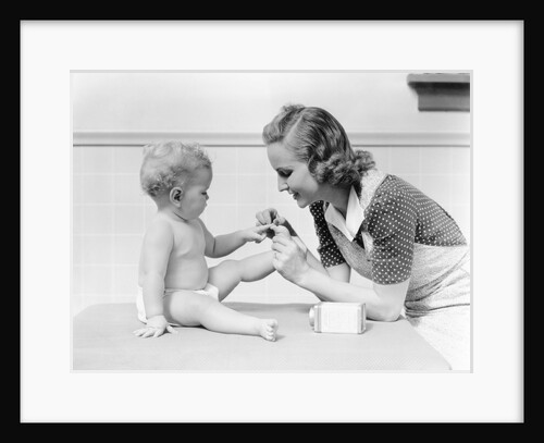 1930s mother touching baby toes fingers this little piggy nursery rhyme by Anonymous