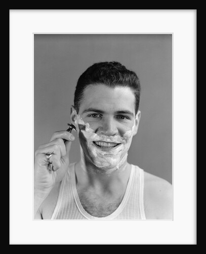 1940s smiling man shaving wearing tee shirt by Anonymous