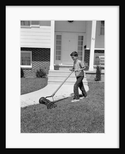 1960s boy cutting mowing suburban home front yard lawn by Anonymous