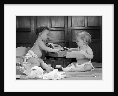 1960s two babies wearing diapers in business office with adding machine playing accountant by Anonymous