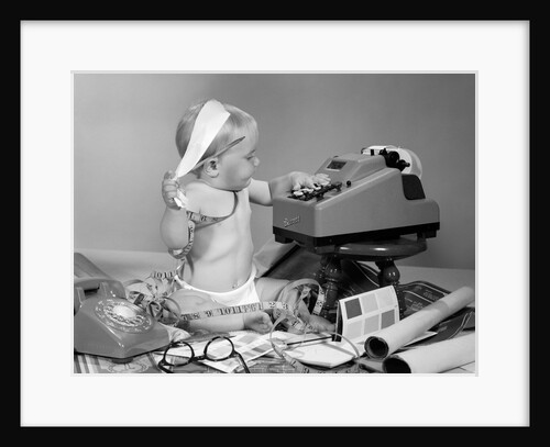 1960s baby with adding machine telephone blueprints paint samples and tape measure by Anonymous