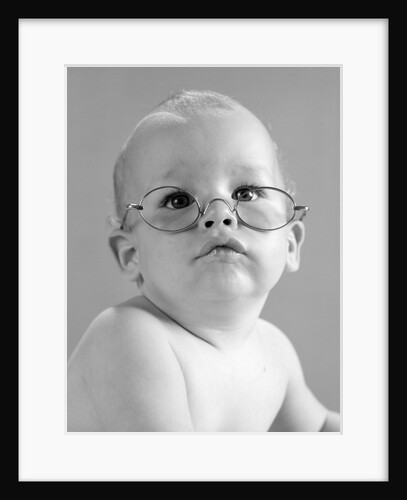 1960s baby wearing wire-rimmed granny glasses by Anonymous