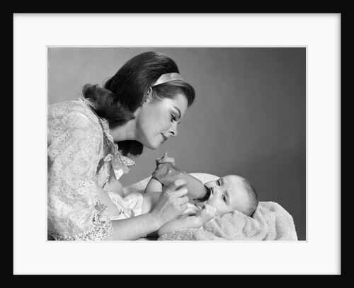 1960s mother bottle feeding infant child by Anonymous