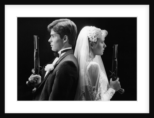 1980s bride and groom standing back to back holding dueling pistols by Anonymous