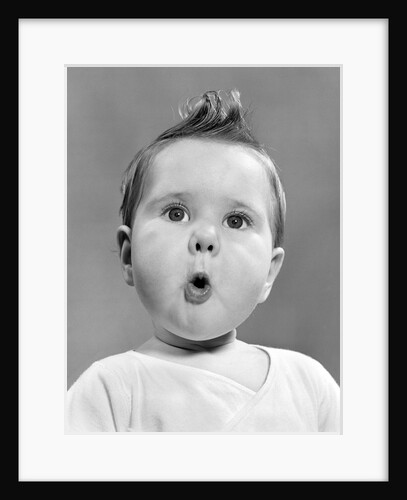 1950s baby with surprised expression by Anonymous