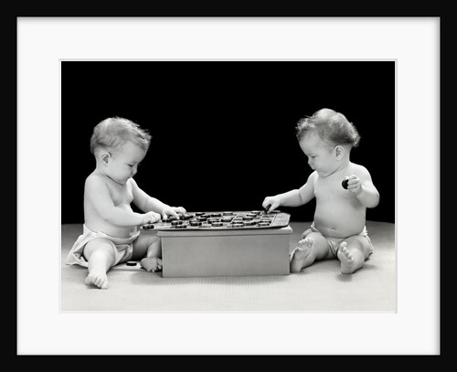 1930s 1940s twin babies playing game of checkers together studio by Anonymous