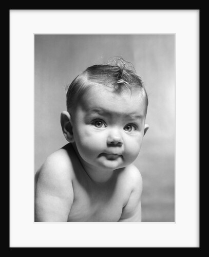 1950s cute smirking baby looking at camera by Anonymous